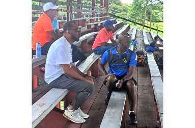 Chief selector Andre  Percival, his fellow selectors and Coach Grimmond (sitting in front) watch yesterday’s practice game at the National Park tarmac (Sean Devers photo).