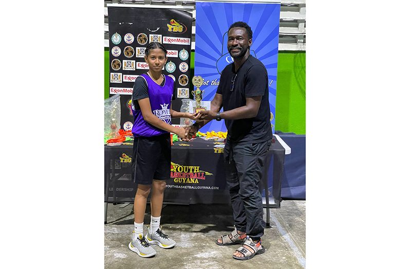 Tavishti Persaud free throw skills winner collecting the trophy from Chris Bowman