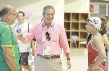 Olympian Aleka Persaud (right) meets PANAM Sports President, Neven Ilic (centre), in the presence of Coach Sean Baksh (left)