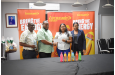 Darshanie Yusuf-Abel, Divisional Head, Beverage (far right) and troy Peters (far left) loos on as Petra Director Troy Mendonca collects Cheque from Christina Beepat, Brand Manager Lucozade