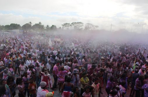 Coloured powder decorates the air at the Guyana National Stadium