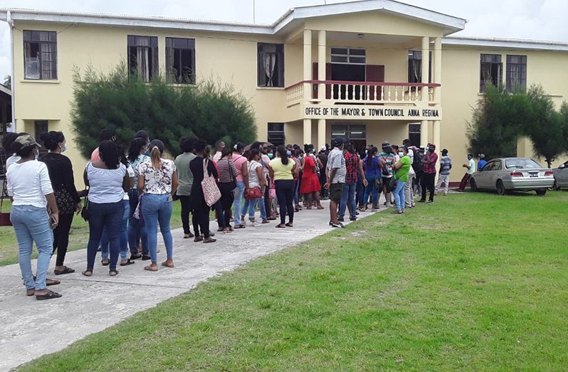 Scores of people lined up at the Anna Regina Town Council to receive the grant