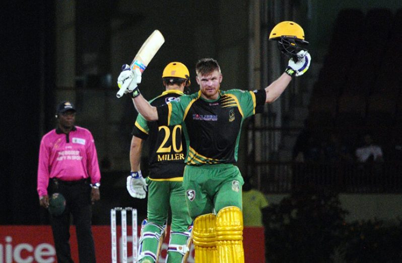 Glenn Phillips
acknowledges his
teammates and the
crowd after scoring
his second T20
hundred.