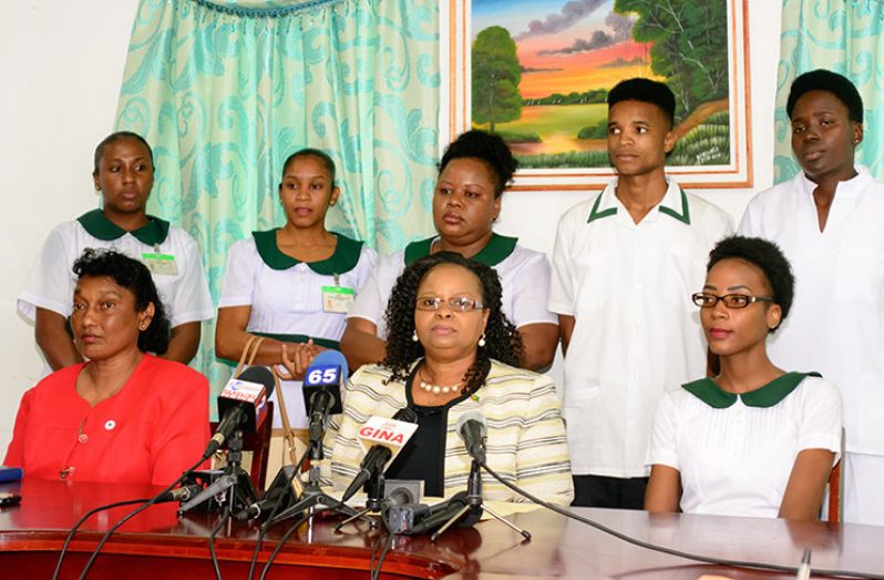 At Monday’s press conference,seated from left, are: Chief Nursing Officer, Ms Tarmattie Barker; Public Health Minister, Ms Volda Lawrence; and student representative, Ms Jeanel Lewis. With them are some of the nursing students affected by the leak (Photo by Samuel Maughn)