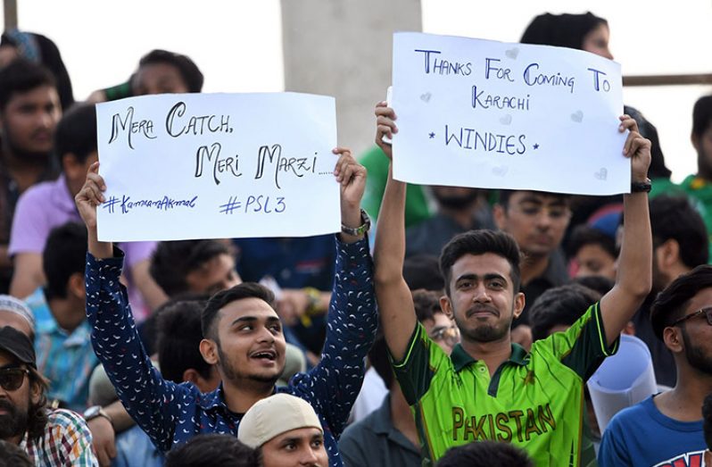 Pakistan fans hold placards thanking West Indies for coming. (AFP)