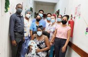 Annecia George with nurses, doctors and midwives at the Suddie Public Hospital