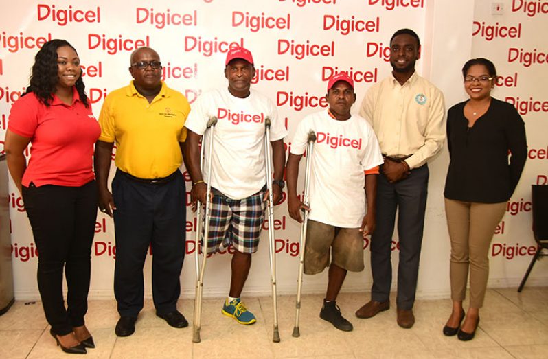 Senior Sponsorship & Events Executive Louanna Abrams stands with head of the Special Olympics committee Wilton Spencer, some of the athletes for the event and Assistant Director of Sport Bryan Smith. To the extreme right is Communications Manager Vidya Bijlall-Sanichara.