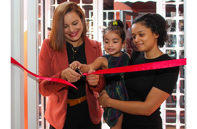 Mandy Field (left) and her daughters, Jasmine (right) and Samaiya cut the ribbon to open Tootie Fruities’s first store (Shaniece Bamfield Photo)