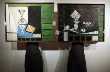 Art handlers pose with "Nature morte" (L) and "Nature morte aux volets verts" by Pablo Picasso, at Christie's auction house in London, Britain, June 1, 2016.(REUTERS/Stefan Wermuth)