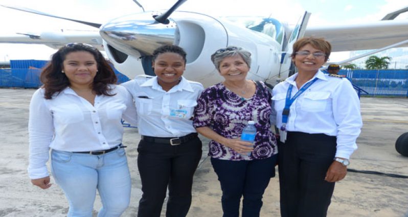 Female ASL pilots (Cpts Brittney Ally, Rebecca Clarke, first and second left), and Ferial Ally,right) pose with Ms. Golas (second right) at ASL Ogle