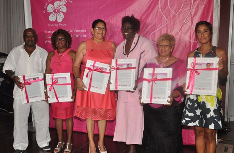 The persons who were awarded with ‘warriors against breast cancer’ frames at the GTT ‘Pinktober’ benefit Tuesday evening (Photo by Delano Williams)