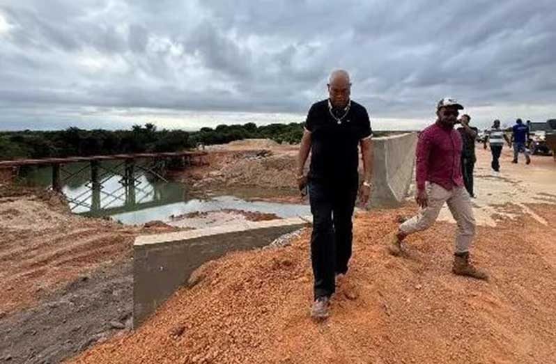 Minister of Public Works, Bishop Juan Edghill, inspects the completed Pirara Bridge