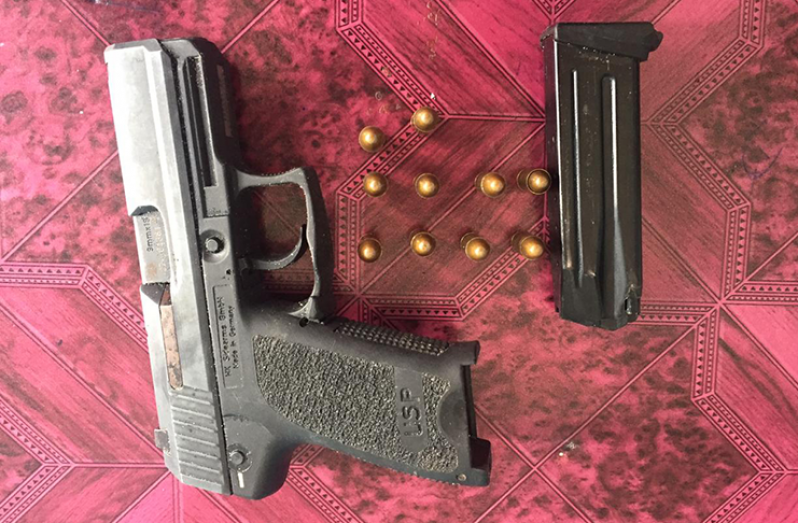 The seized pistol with live rounds