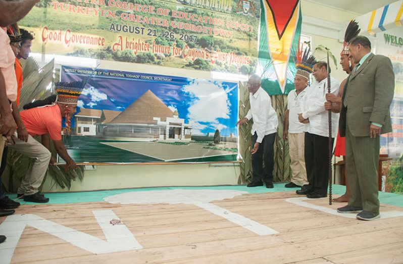 President David Granger and NTC Chairman Joel Fredericks unveil an artist’s impression of the NTC Secretariat, which is to be constructed at the Sophia Exhibition Site (Delano Williams)