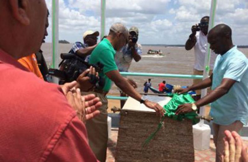 President David Granger and Mayor of Bartica Gifford Marshall, unveiling the plaque to mark the commissioning of the Golden Beach Development Project