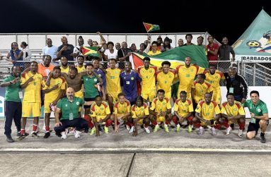 Players and management of the Golden Jaguars celebrate with fans after the historic win over Guatemala (PHOTO: Guyana Football Federation)