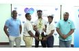 Players from Chase Academic Foundation, Charlestown Secondary and West Ruimveldt with trophy in hand flanked by RBL Regional Manager, Commercial and Retail Banking Stanton Grant (far left) and Petra Director Troy Mendonca (far right)