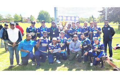 The victorious Malvern All Stars players and supporters. At extreme right is OSCL President, Shiv Persaud, while Vice-president Amit Bacchus is extreme left.