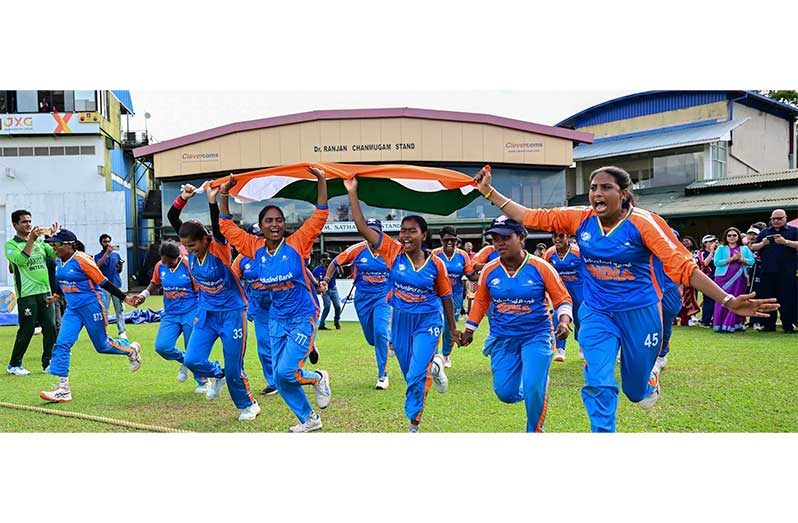 The Indian players celebrate their historic victory