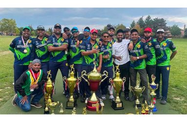 The victorious Better Hope players celebrate their retention of the title