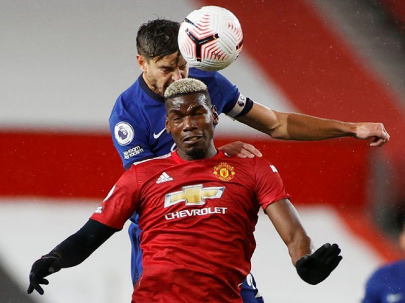 Soccer Football - Premier League - Manchester United v Chelsea - Old Trafford, Manchester, Britain - October 24, 2020 Manchester United's Paul Pogba in action with Chelsea's Cesar Azpilicueta Pool via REUTERS/Phil Noble