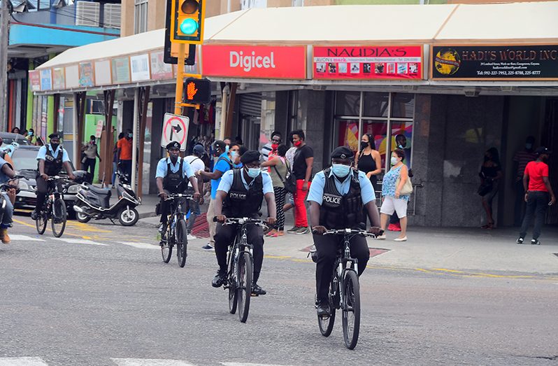 Bicycle police on patrol on Camp Street Georgetown