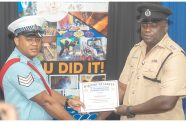 One of the graduands receiving his certificate by ASP Henry