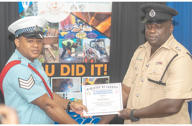 One of the graduands receiving his certificate by ASP Henry