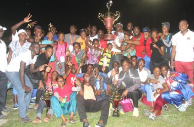 CHAMPS!!! Athletes from the Police Sports Club celebrate after winning the 2014 Boyce and Jefford Track & Field Classic last Sunday at the Mackenzie Sports Club. (Sonell Nelson photo)