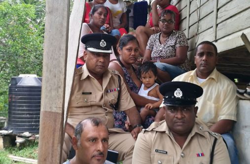 Commander of “F” Division- Senior Superintendent Ravindradat Budhram and Assistant Superintendent Kamraj Shivbarran with civil society representative and some of the relatives of the deceased police rank.
