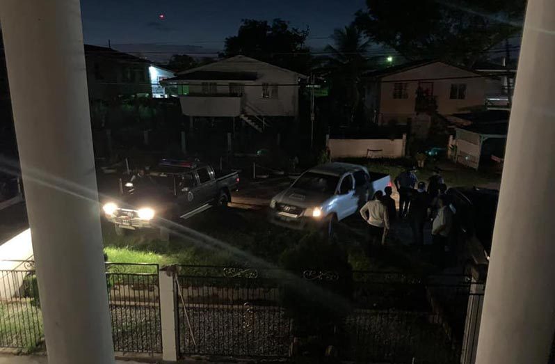 Police in front of Christopher Jones’ home waiting to gain entry Thursday evening