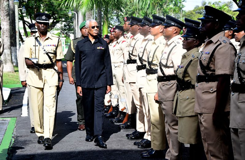 President David Granger inspects the Guard of Honour ahead of the opening ceremony for the Police Officers Conference (Adrian Narine photo)