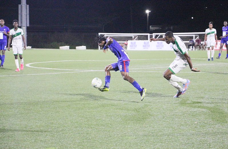 Nicholas McArthur in action for the Guyana Police Football Club against Den Amstel Football Club on Thursday evening.