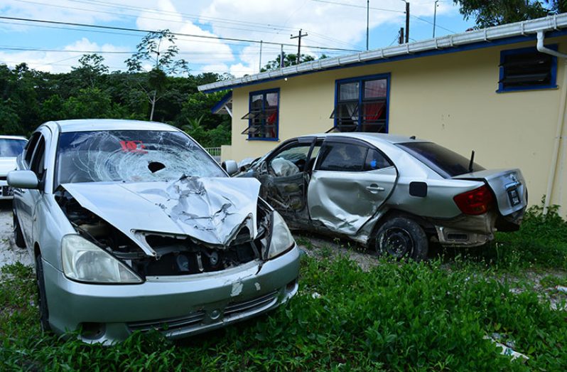 The two crashed Toyota Allion cars owned by the policemen involved in separate accidents in the wee hours of Sunday morning, parked at the Madewini Police Station