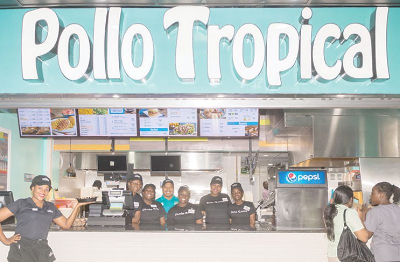 Pollo Tropical staff pose at the restaurant’s new branch at Giftland Mall