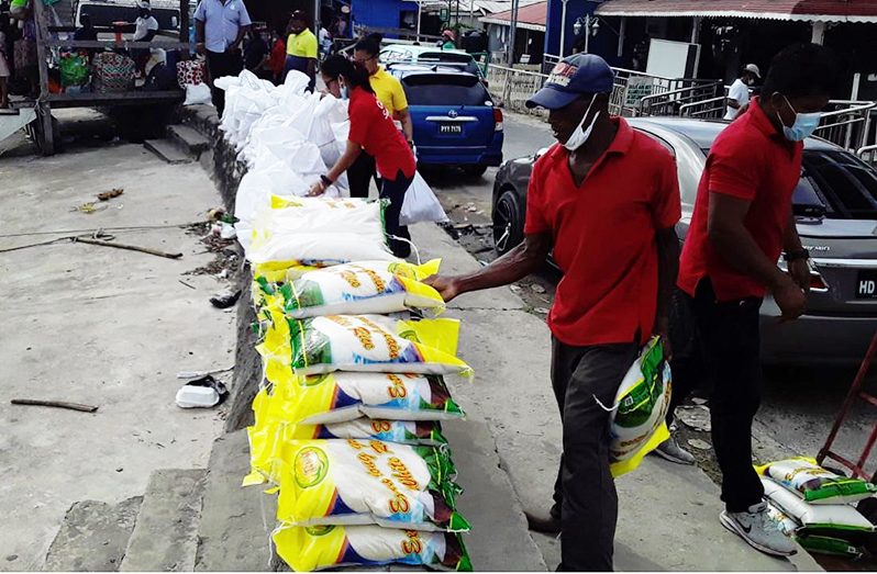 Workers of Gaulin Supermarket packed the food supplies for distribution