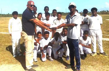 Poonai Bhigroog hands over cricket sponsorship to RHTYSC
Cricket Manager, Robby Kissoonlall, while the team looks on