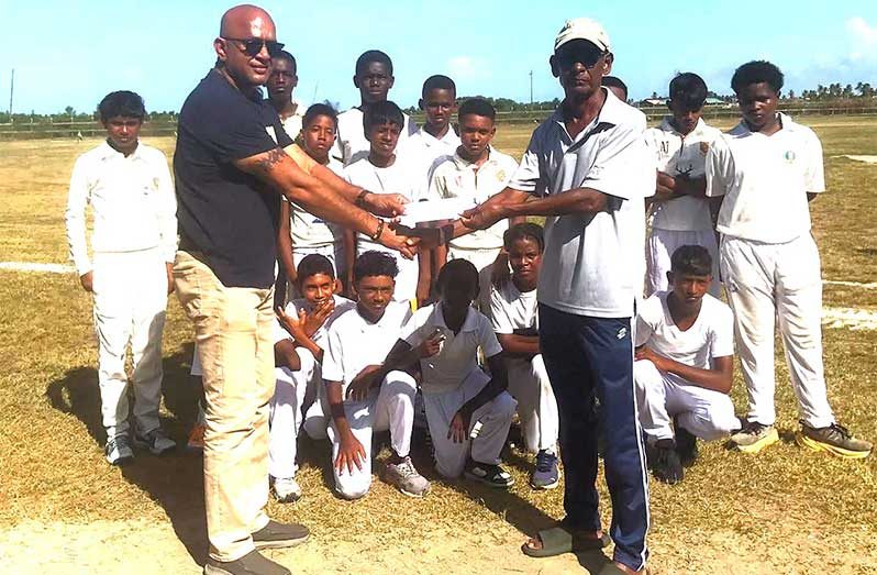 Poonai Bhigroog hands over cricket sponsorship to RHTYSC
Cricket Manager, Robby Kissoonlall, while the team looks on