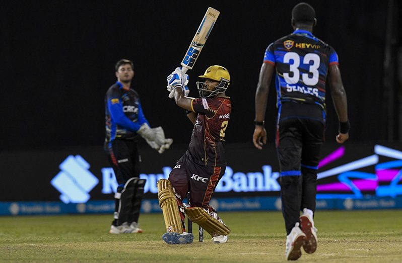 Nicholas Pooran (L) of Trinbago Knight Riders hits a six off Jayden Seales (R) of Antigua and Barbuda Falcons to win the Men's 2025 Republic Bank Caribbean Premier League Eliminator, match 31 between Trinbago Knight Riders and Antigua and Barbuda Falcons at the Guyana National Stadium on September 16, 2025 at Providence, Guyana. (Photo by Randy Brooks/CPL T20 via Getty Images)