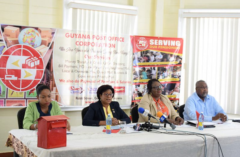 Minister of Public Telecommunications Catherine Hughes addressing reporters at the Guyana Post Office Corporation Training Centre in Georgetown on the importance of mail boxes. Also included in the photo are: GPOC PRO Telesha Whyte (sitting on Minister’s left), the Postmaster General Karen Brown (right of the minister) and Reverend Raphael Massiah –GPOC Chairman (DPI Photo)