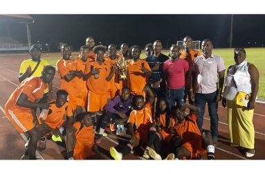 WDFA bounce-back champions, Pouderoyen Football Club seen with Association president Trevor Williams (2nd right) and second vice-president Christine Schmidt (right) following the presentation