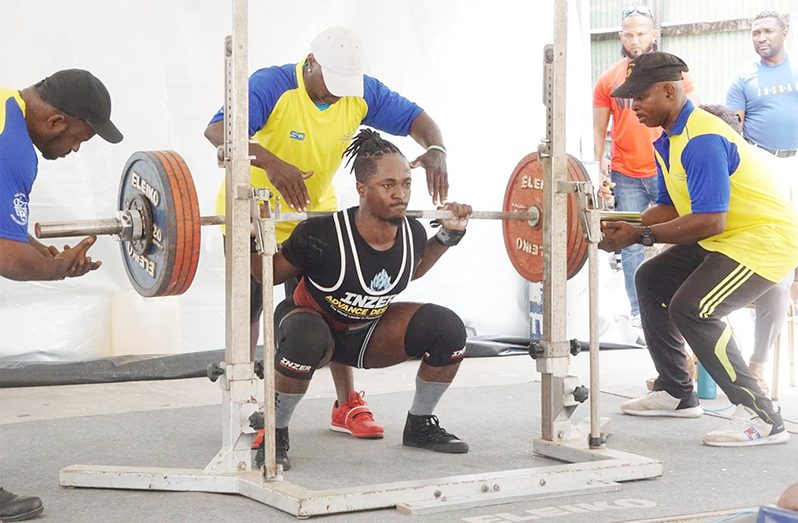 Kheon Evans doing the squat during a recent competition locally