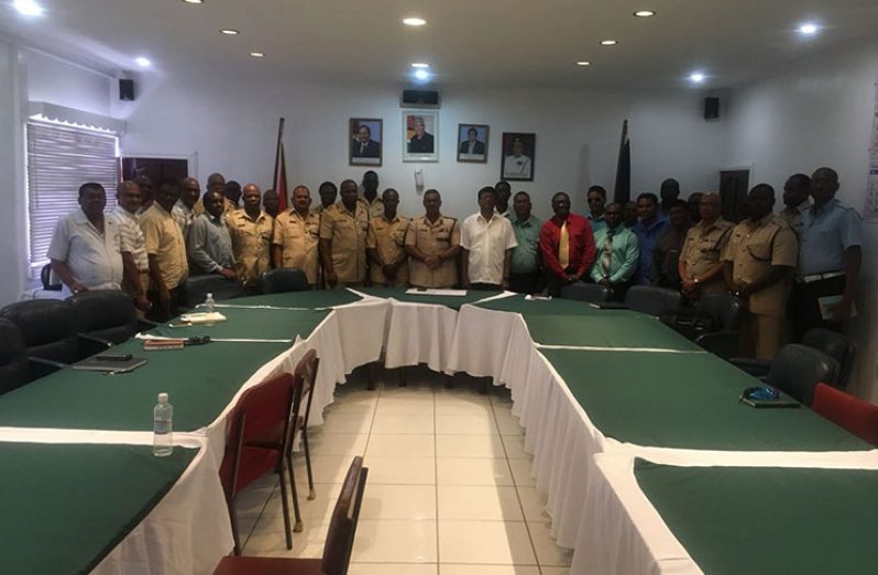 Police Commissioner (ag) David Ramnarine,centre,is flanked by senior police officers and members of the Cops and Faith Community Network after the meeting