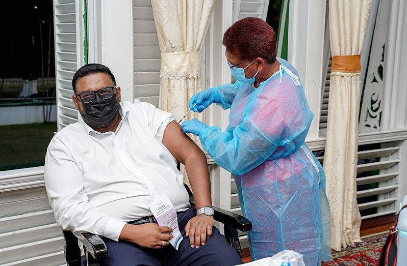 President, Dr. Irfaan Ali, taking his first dose of the Oxford-AstraZeneca COVID-19 vaccine (Office of the President photo)