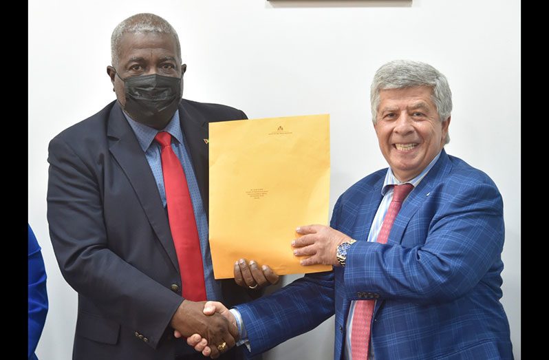 Prime Minister, Brigadier (Ret’d) Mark Phillips presenting the licence to a company Director, David Mahmalji (DPI photograph)