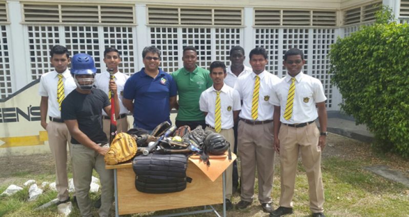 President Robin Singh and Coach Osafo Dos Santos flanked by QC students