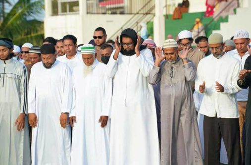 President Dr Irfaan Ali (centre, front row) takes part in a prayer.