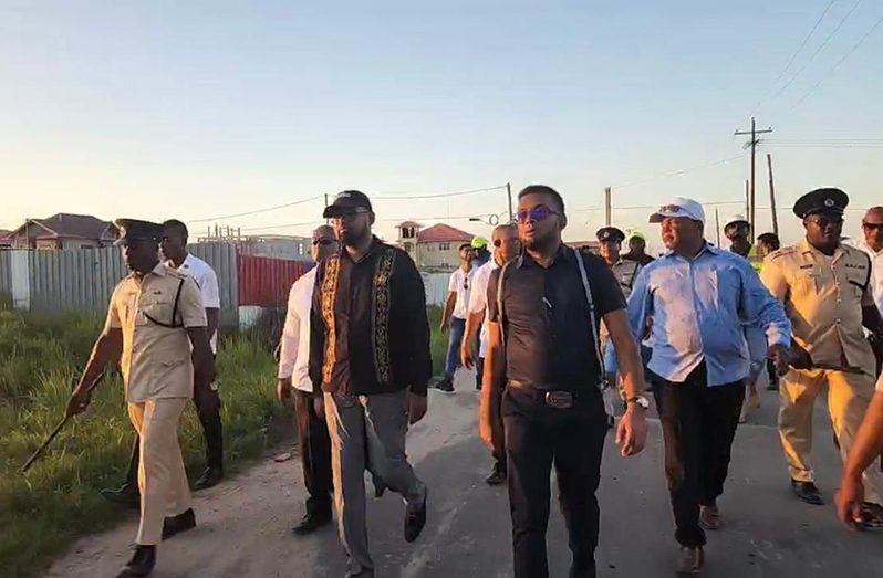 President, Dr Irfaan Ali, along with several officials during the walkabout on Thursday