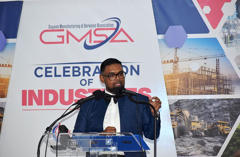 President Dr. Irfaan Ali engaging  stakeholders at the GMSA’s annual award ceremony and dinner, which was held at the Ramada Princess Hotel on Tuesday (Elvin Carl Croker photo)