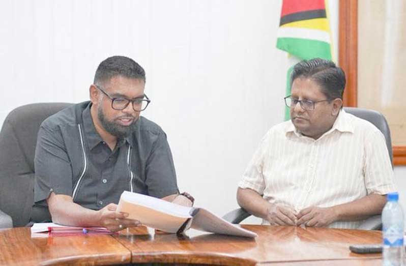 President Dr. Irfaan Ali (left) and Finance Minister Dr. Ashni Singh at the Ministry of Finance photographed back in 2024